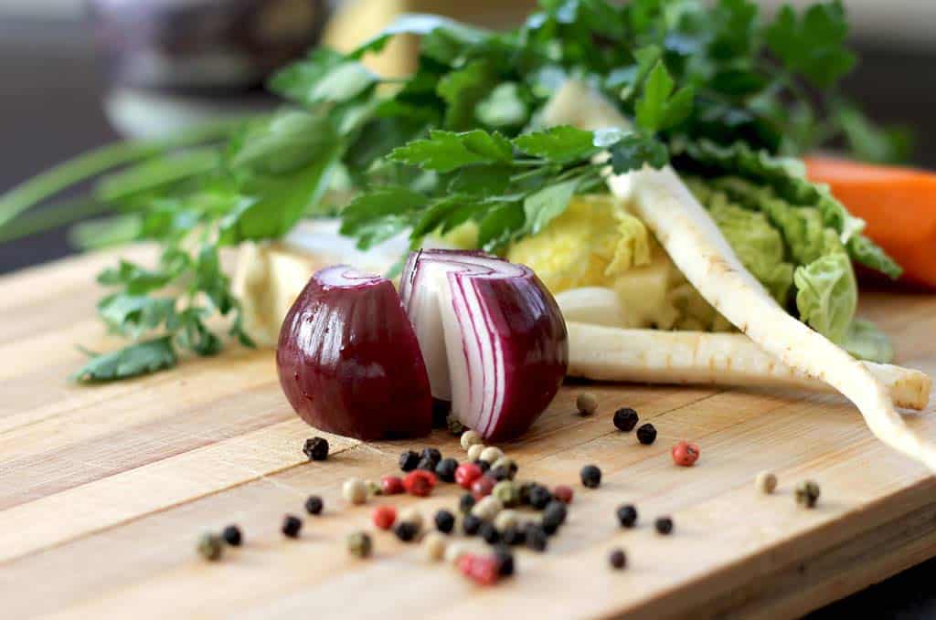 vegetables being cut up for a sauce